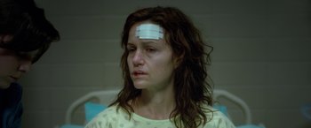 Movie still from “Gerald's Game” (2017), directed by Mike Flanagan – A woman with bandages on her head; Close Up shot, Over the shoulder angle