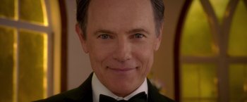 Movie still from “Gerald's Game” (2017), directed by Mike Flanagan – A person wearing a tuxedo; Close Up shot, Over the shoulder angle