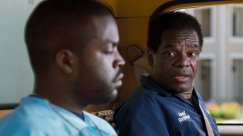 Movie still from “Next Friday” (2000), directed by Steve Carr – Two men sitting next to each other in a vehicle; Close Up shot, Over the shoulder angle