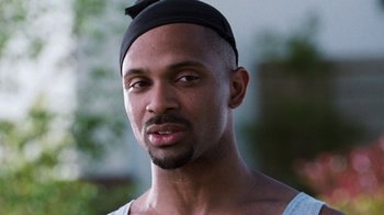 Movie still from “Next Friday” (2000), directed by Steve Carr – A person wearing a hat; Close Up shot, Low angle