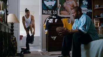 Movie still from “Next Friday” (2000), directed by Steve Carr – Two men are playing basketball in a bedroom; Wide shot, High angle