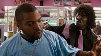 Movie still from “Next Friday” (2000), directed by Steve Carr – A man getting his hair cut in a barber shop; Close Up shot, Over the shoulder angle