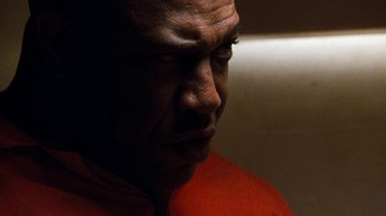 Movie still from “Next Friday” (2000), directed by Steve Carr – A person wearing an orange shirt; Close Up shot, Low angle