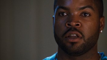 Movie still from “Next Friday” (2000), directed by Steve Carr – A man's face in the dark; Close Up shot, Over the shoulder angle