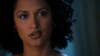 Movie still from “Next Friday” (2000), directed by Steve Carr – A woman's face in a dark room; Close Up shot, Over the shoulder angle