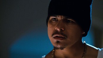 Movie still from “Next Friday” (2000), directed by Steve Carr – A person wearing a hat; Close Up shot, Low angle