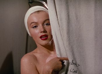 Movie still from “Niagara” (1953), directed by Henry Hathaway – A woman in a white hat is taking a shower; Close Up shot, Low angle