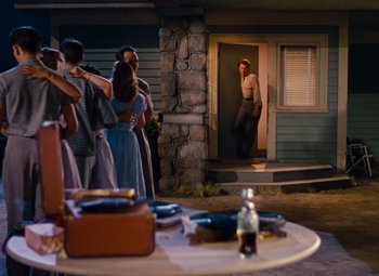 Movie still from “Niagara” (1953), directed by Henry Hathaway – A group of people standing in front of a door; Wide shot, Over the shoulder angle