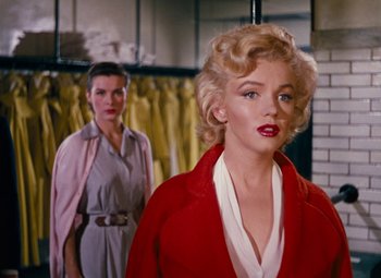 Movie still from “Niagara” (1953), directed by Henry Hathaway – Two women standing next to each other in a room; Medium shot, Over the shoulder angle