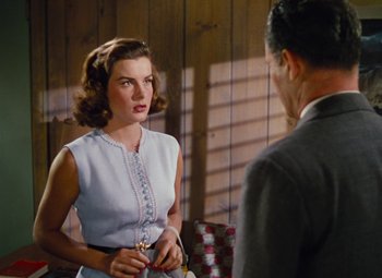 Movie still from “Niagara” (1953), directed by Henry Hathaway – A man and a woman are talking in a room; Medium shot, Over the shoulder angle