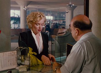 Movie still from “Niagara” (1953), directed by Henry Hathaway – A woman sitting at a table with a man; Medium shot, Over the shoulder angle