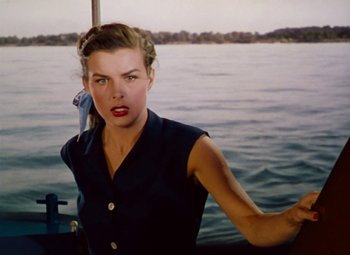Movie still from “Niagara” (1953), directed by Henry Hathaway – A woman standing on the deck of a boat in the water; Close Up shot, High angle