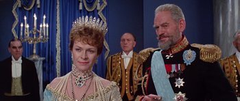 Movie still from “Nicholas and Alexandra” (1971), directed by Franklin J. Schaffner – Two men and a woman dressed in formal clothing; Medium shot, Low angle