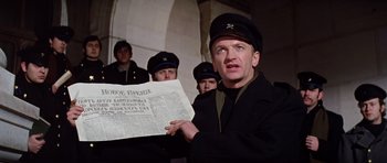 Movie still from “Nicholas and Alexandra” (1971), directed by Franklin J. Schaffner – A group of men standing next to each other holding papers; Close Up shot, Low angle