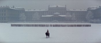 Movie still from “Nicholas and Alexandra” (1971), directed by Franklin J. Schaffner – A person riding a horse in the snow; Extreme Wide shot, Low angle