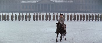 Movie still from “Nicholas and Alexandra” (1971), directed by Franklin J. Schaffner – A man riding a horse in front of a group of soldiers; Wide shot, Low angle