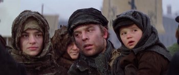 Movie still from “Nicholas and Alexandra” (1971), directed by Franklin J. Schaffner – A man and two women are standing in the snow; Close Up shot, Low angle