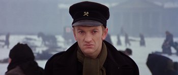 Movie still from “Nicholas and Alexandra” (1971), directed by Franklin J. Schaffner – A man wearing a hat and a scarf; Close Up shot, Low angle