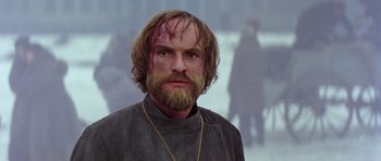 Movie still from “Nicholas and Alexandra” (1971), directed by Franklin J. Schaffner – A man with a beard and a mustache with blood on his face; Close Up shot, Low angle