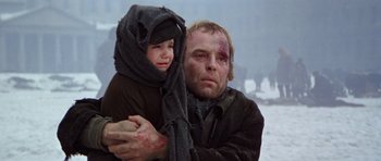 Movie still from “Nicholas and Alexandra” (1971), directed by Franklin J. Schaffner – A man and a child in the middle of a snow covered field; Close Up shot, Low angle