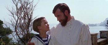 Movie still from “Nicholas and Alexandra” (1971), directed by Franklin J. Schaffner – A man and a boy standing next to each other; Close Up shot, Low angle
