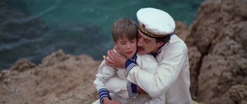 Movie still from “Nicholas and Alexandra” (1971), directed by Franklin J. Schaffner – A man and a boy in sailor's uniform hugging; Close Up shot, High angle