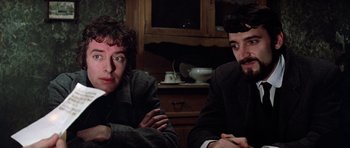 Movie still from “Nicholas and Alexandra” (1971), directed by Franklin J. Schaffner – A couple of men sitting next to each other in a room; Close Up shot, Low angle