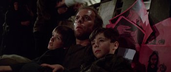 Movie still from “Nicholas and Alexandra” (1971), directed by Franklin J. Schaffner – A man and two young boys sitting next to each other; Close Up shot, Low angle
