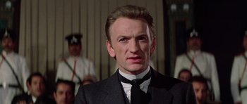 Movie still from “Nicholas and Alexandra” (1971), directed by Franklin J. Schaffner – A person wearing a suit and tie; Close Up shot, Low angle