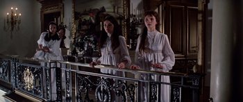 Movie still from “Nicholas and Alexandra” (1971), directed by Franklin J. Schaffner – Two young women in white dresses standing next to a railing; Medium shot, Low angle