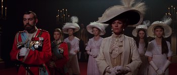 Movie still from “Nicholas and Alexandra” (1971), directed by Franklin J. Schaffner – A group of people in fancy hats standing next to each other; Medium shot, Low angle