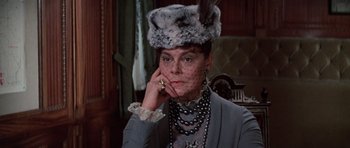 Movie still from “Nicholas and Alexandra” (1971), directed by Franklin J. Schaffner – A woman wearing a fur hat and a necklace; Close Up shot, Over the shoulder angle