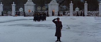 Movie still from “Nicholas and Alexandra” (1971), directed by Franklin J. Schaffner – A soldier saluting in front of a group of people; Wide shot, Low angle