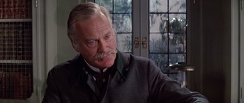 Movie still from “Nicholas and Alexandra” (1971), directed by Franklin J. Schaffner – An older man with a mustache and a mustache stand in front of a window; Close Up shot, Low angle