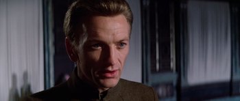 Movie still from “Nicholas and Alexandra” (1971), directed by Franklin J. Schaffner – A person wearing a suit; Close Up shot, Low angle