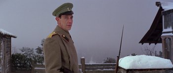 Movie still from “Nicholas and Alexandra” (1971), directed by Franklin J. Schaffner – A man in a military uniform is holding a rifle; Close Up shot, Low angle