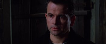 Movie still from “Nicholas and Alexandra” (1971), directed by Franklin J. Schaffner – A person wearing a black jacket; Close Up shot, Low angle