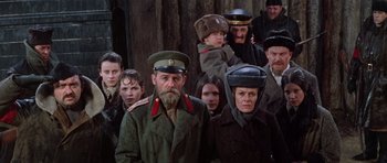 Movie still from “Nicholas and Alexandra” (1971), directed by Franklin J. Schaffner – A group of men and women wearing hats and coats; Medium shot, High angle
