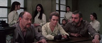 Movie still from “Nicholas and Alexandra” (1971), directed by Franklin J. Schaffner – A group of people sitting around a table; Medium shot, Low angle