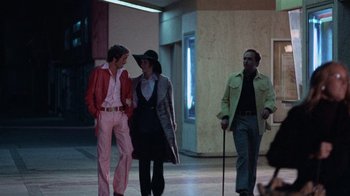 Movie still from “Night Moves” (1975), directed by Arthur Penn – A group of people standing in a room; Wide shot, Low angle