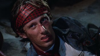 Movie still from “Night Moves” (1975), directed by Arthur Penn – A person with a bandana on; Close Up shot, Overhead angle