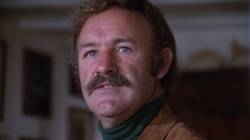 Movie still from “Night Moves” (1975), directed by Arthur Penn – A person with a mustache; Close Up shot, Low angle