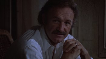 Movie still from “Night Moves” (1975), directed by Arthur Penn – An older man with a ring in his hand; Close Up shot, Low angle