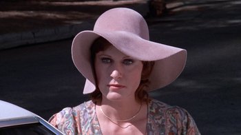 Movie still from “Night Moves” (1975), directed by Arthur Penn – A person wearing a hat; Close Up shot, Low angle