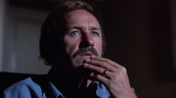 Movie still from “Night Moves” (1975), directed by Arthur Penn – A person with a ring on his finger; Close Up shot, Low angle