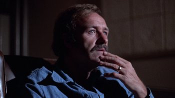 Movie still from “Night Moves” (1975), directed by Arthur Penn – A person with a ring on his finger; Close Up shot, Low angle