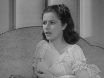 Movie still from “Night Train to Munich” (1940), directed by Carol Reed – A black - and - white photo of a young woman; Close Up shot, High angle