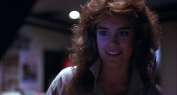 Movie still from “Night of the Comet” (1984), directed by Thom Eberhardt – A person wearing a white shirt; Close Up shot, Low angle