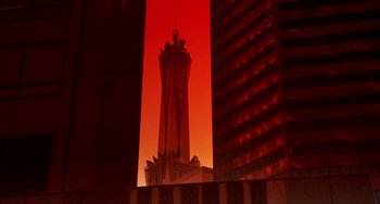 Movie still from “Night of the Comet” (1984), directed by Thom Eberhardt – A tall building with a red sky in the background; Extreme Wide shot, Low angle