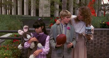 Movie still from “Night of the Comet” (1984), directed by Thom Eberhardt – A group of people standing next to each other; Medium shot, Over the shoulder angle
